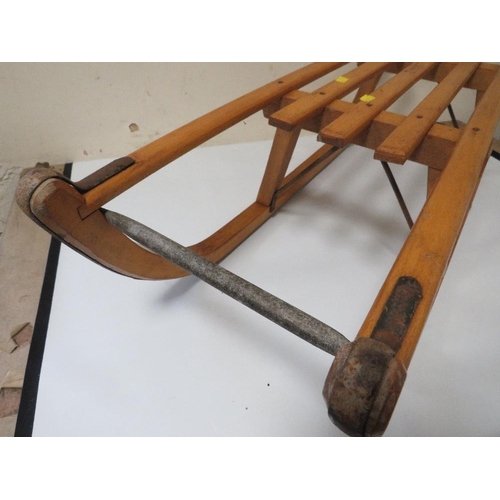 217 - A VINTAGE DAVOS WOODEN SLEDGE