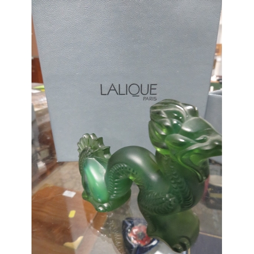 323 - A BOXED LALIQUE GLASS DRAGON PAPERWEIGHT