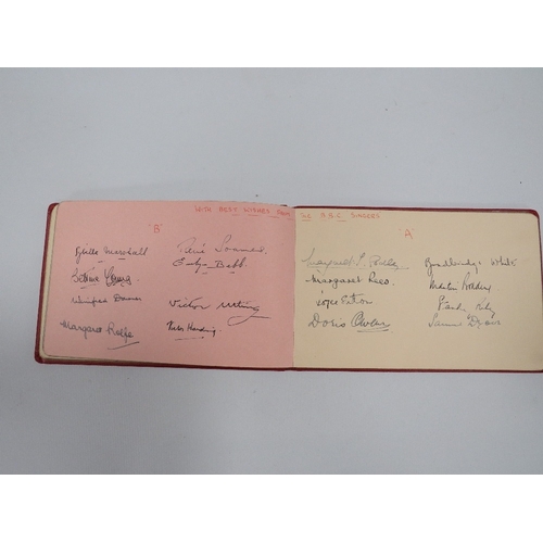 378 - A SMALL RED AUTOGRAPH BOOK CONTAINING EXAMPLES CIRCA 1940