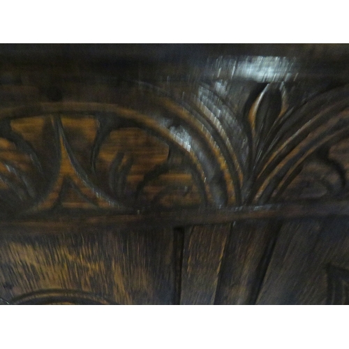 789 - AN OAK CARVED PANELLED COFFER W 105 CM