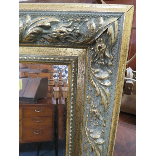 800 - A LARGE MODERN GILT WALL MIRROR 142 X 110 CM