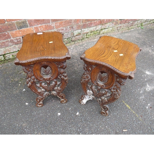 819 - A PAIR OF UNUSUAL CARVED OAK VINTAGE STOOLS