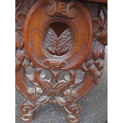 819 - A PAIR OF UNUSUAL CARVED OAK VINTAGE STOOLS