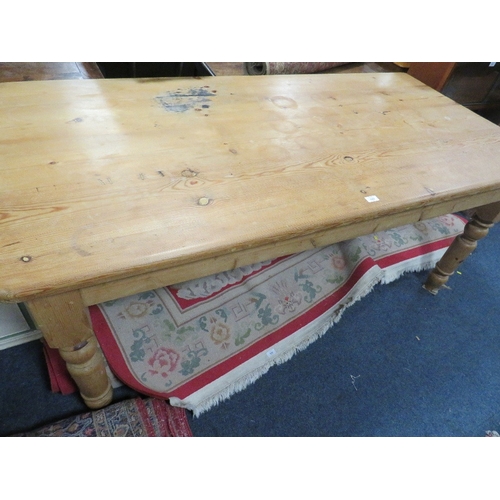 829 - A LARGE HONEY PINE FARMHOUSE STYLE TABLE L 182 CM