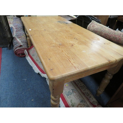 829 - A LARGE HONEY PINE FARMHOUSE STYLE TABLE L 182 CM