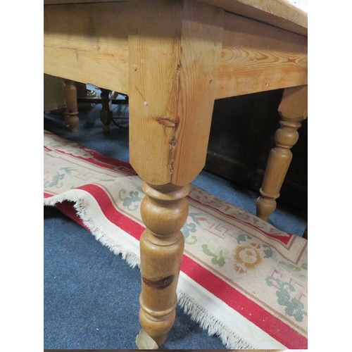 829 - A LARGE HONEY PINE FARMHOUSE STYLE TABLE L 182 CM