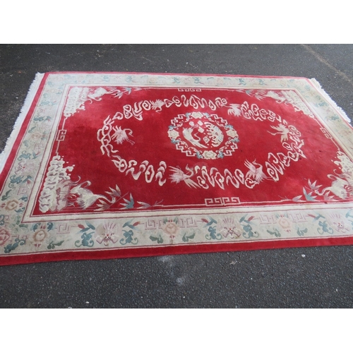 830 - A LARGE CHINESE WOOLLEN RUG - APPROX 217 x 310 cm