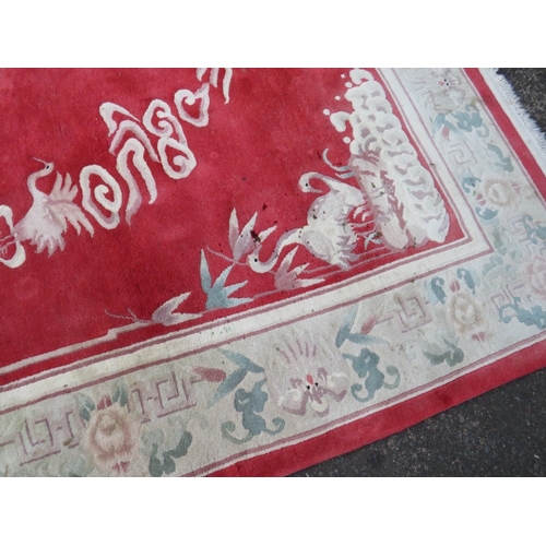 830 - A LARGE CHINESE WOOLLEN RUG - APPROX 217 x 310 cm