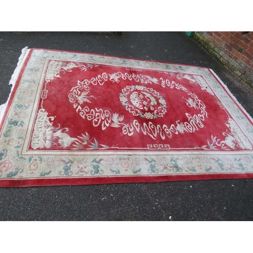 830 - A LARGE CHINESE WOOLLEN RUG - APPROX 217 x 310 cm