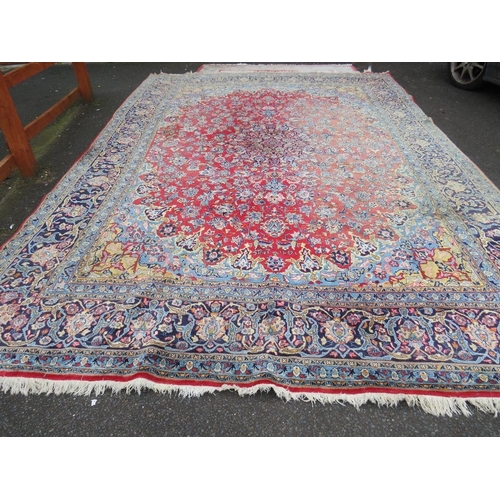 832 - A LARGE EASTERN WOOLLEN RUG APPROX 442 x 313 cm