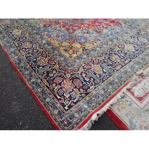 832 - A LARGE EASTERN WOOLLEN RUG APPROX 442 x 313 cm