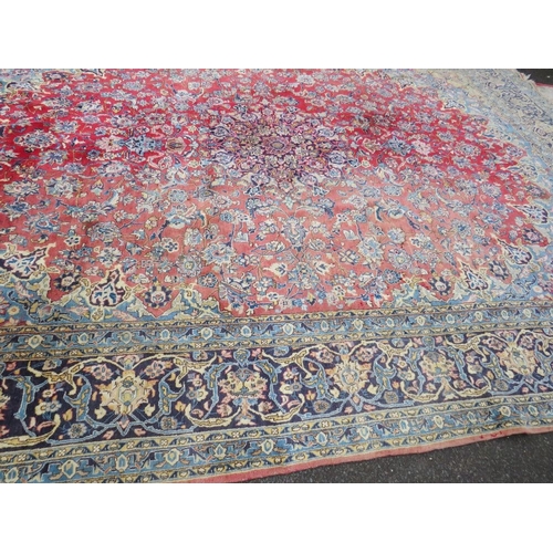 832 - A LARGE EASTERN WOOLLEN RUG APPROX 442 x 313 cm