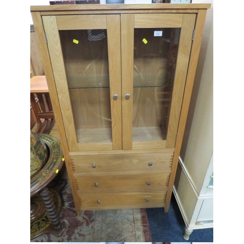 833 - A MODERN OAK EFFECT GLAZED CABINET WITH DRAWERS