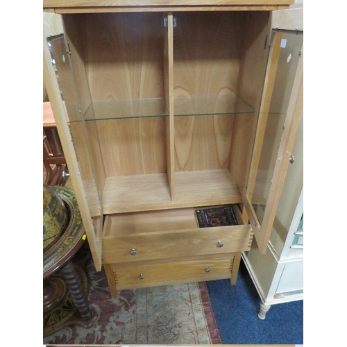 833 - A MODERN OAK EFFECT GLAZED CABINET WITH DRAWERS