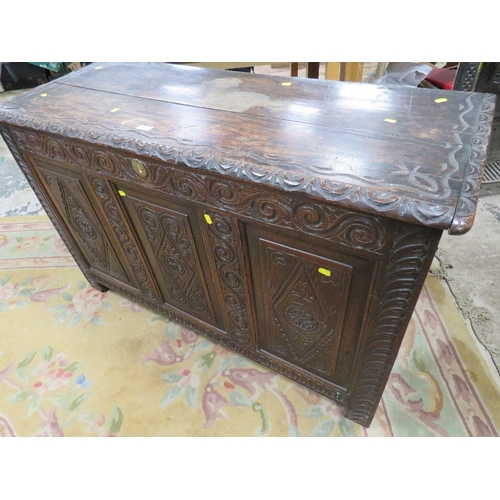 701 - AN ANTIQUE CARVED OAK COFFER W -124 CM