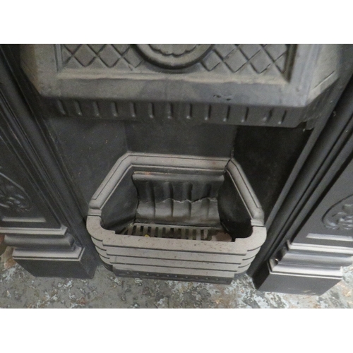 704 - A VINTAGE CAST IRON FIRE SURROUND AND GRATE