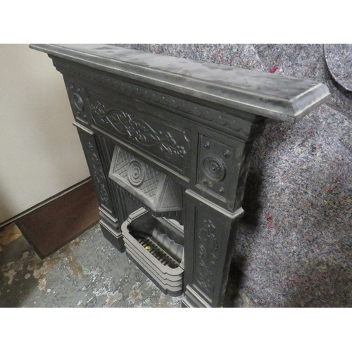 704 - A VINTAGE CAST IRON FIRE SURROUND AND GRATE