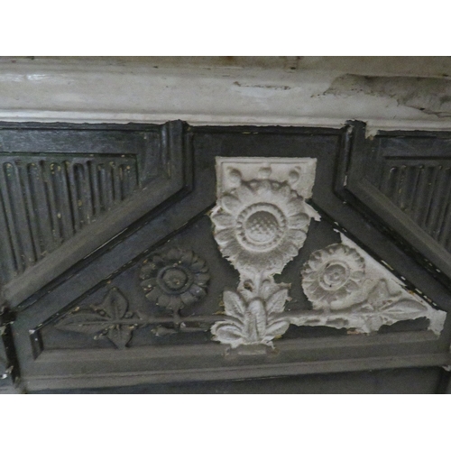 707 - A SMALL VINTAGE  CAST IRON FIRE SURROUND