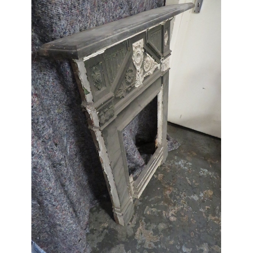 707 - A SMALL VINTAGE  CAST IRON FIRE SURROUND