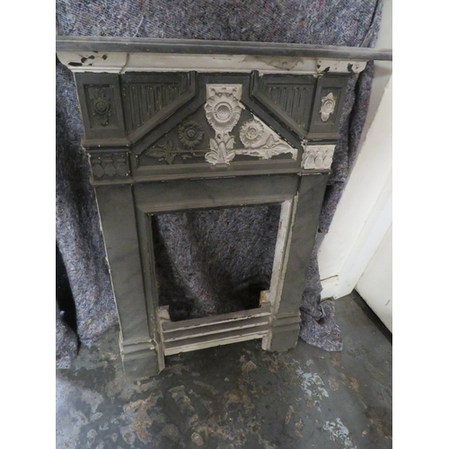 707 - A SMALL VINTAGE  CAST IRON FIRE SURROUND