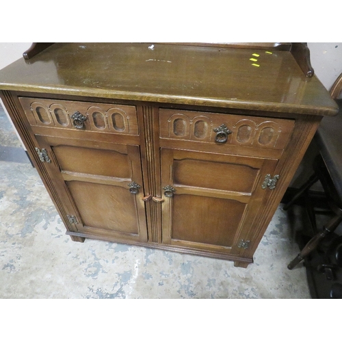 709 - AN OAK ARCHED DRESSER