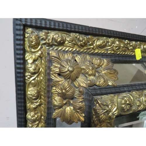 713 - A VINTAGE CUSHION FRONTED AND GILT WALL MIRROR 67 X 58 CM