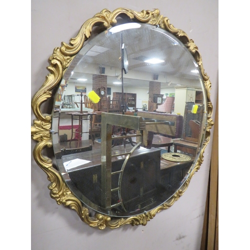 718 - A REPRODUCTION GILT WALL CLOCK AND GILT WALL MIRROR (2)