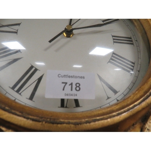 718 - A REPRODUCTION GILT WALL CLOCK AND GILT WALL MIRROR (2)