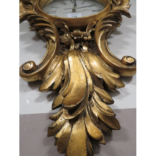 718 - A REPRODUCTION GILT WALL CLOCK AND GILT WALL MIRROR (2)