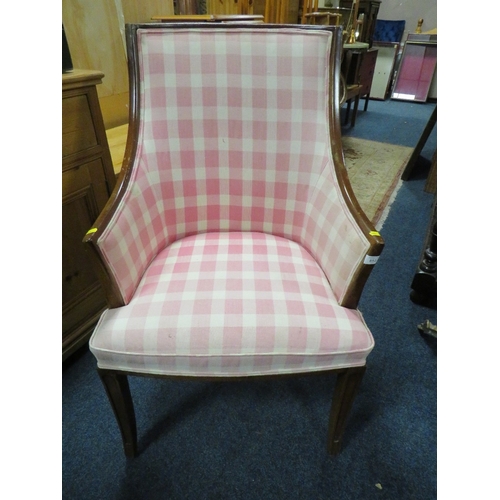 852 - AN UPHOLSTERED ARMCHAIR