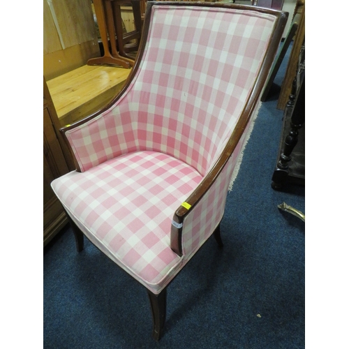 852 - AN UPHOLSTERED ARMCHAIR