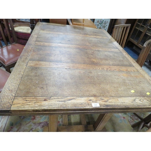 858 - A LARGE OAK DRAWER LEAF TABLE AND EIGHT CHAIRS