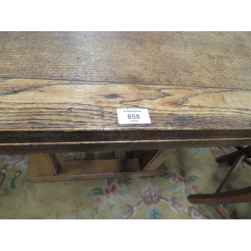 858 - A LARGE OAK DRAWER LEAF TABLE AND EIGHT CHAIRS