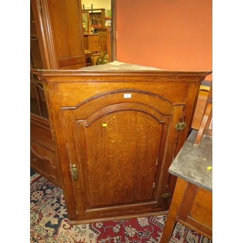 787 - AN ANTIQUE LARGE OAK HANGING CORNER CUPBOARD