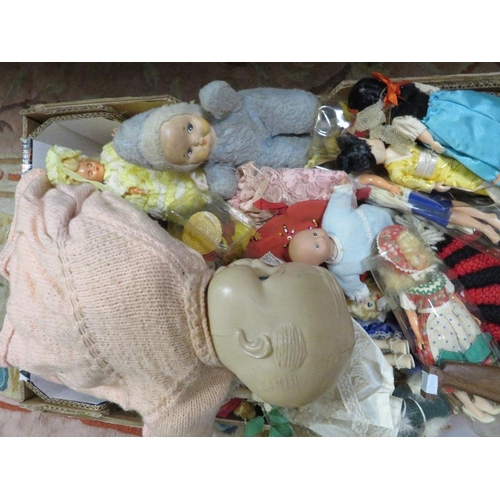 88 - A TRAY OF TREEN TO INCLUDE MASKS TOGETHER WITH A TRAY OF ASSORTED DOLLS