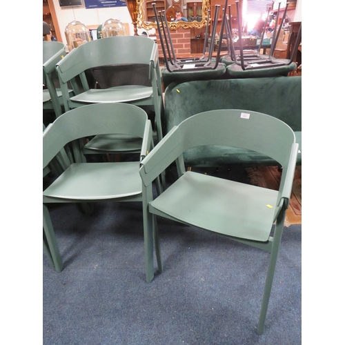 803 - A SET OF FOUR MODERN GREEN PLASTIC STACKING CHAIRS