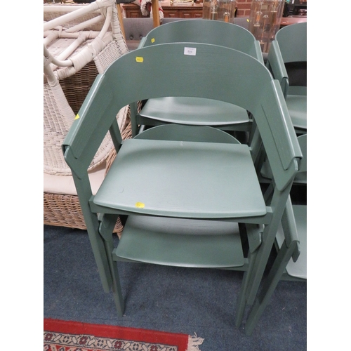 804 - A SET OF FOUR MODERN GREEN PLASTIC STACKING CHAIRS