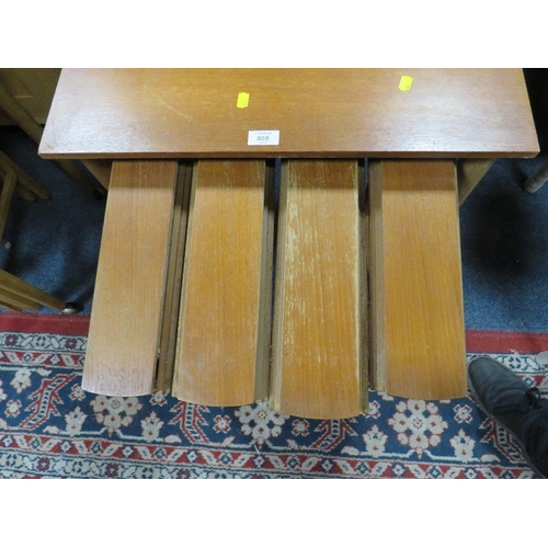 808 - A MID CENTURY TEAK NEST OF TABLES ON CASTORS