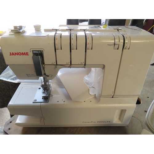 A JANOME COVER PRO 2000CPX OVERLOCKER SEWING MACHINE