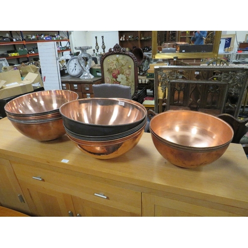 811 - A COLLECTION OF SIXTEEN LARGE COPPER ? BOWLS / SHADES - DIA. 42 CM