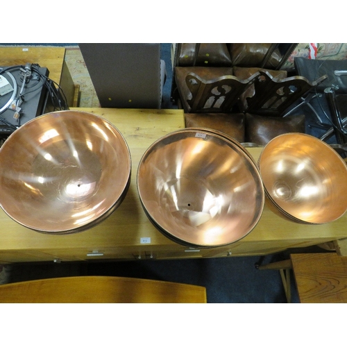 811 - A COLLECTION OF SIXTEEN LARGE COPPER ? BOWLS / SHADES - DIA. 42 CM