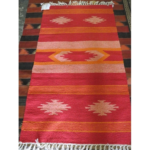 847 - A RED / ORANGE WOOLLEN RUG - 90 X 150 CM