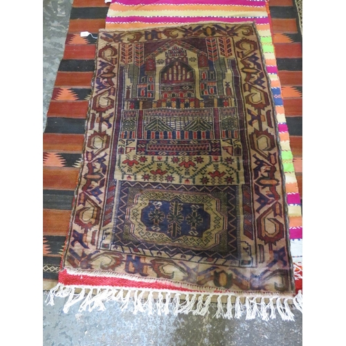 849 - A PATTERNED WOOLLEN RUG - 127 X 90 CM