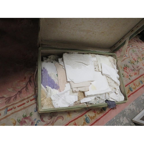 115 - A GREEN CABIN TRUNK CONTAINING A LARGE QUANTITY OF NEEDLE WORK AND LINEN