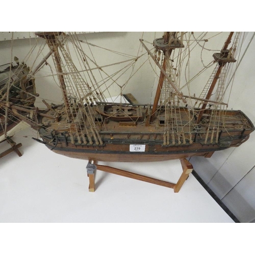 239 - A VINTAGE SCRATCH BUILT MODEL OF A GALLEON TOGETHER WITH A LARGER EXAMPLE