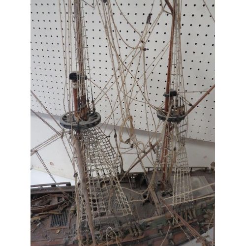 239 - A VINTAGE SCRATCH BUILT MODEL OF A GALLEON TOGETHER WITH A LARGER EXAMPLE