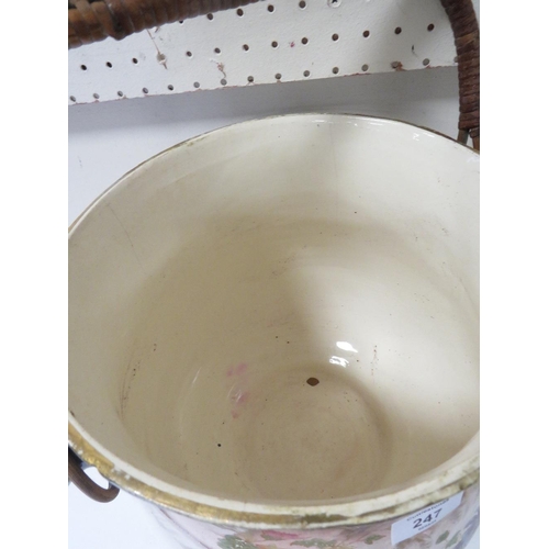 247 - A VINTAGE CERAMIC DRAINING POT WITH WICKER WORK HANDLE