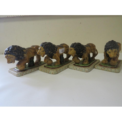 253 - FOUR REPRODUCTION STAFFORDSHIRE STYLE LIONS FIGURES