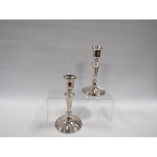 369 - A GOOD PAIR OF WEIGHTED HALLMARKED SILVER CANDLESTICKS H 17 CM