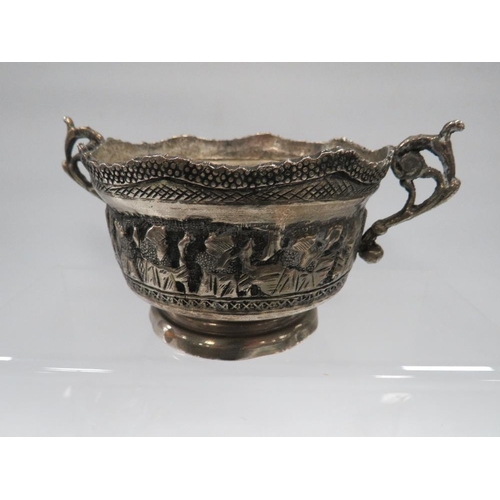 370 - A HALLMARKED SILVER TOPPED GLASS MUSTARD POT ALONG WITH AN EASTERN WHITE METAL TWIN HANDLED BOWL AND... 